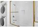 Detailed shower and laundry area, featuring white subway tiles and glass doors at 35 Society St # D, Charleston, SC 29401