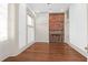 Bright living room showcasing exposed brick fireplace, hardwood floors, and natural light at 35 Society St # D, Charleston, SC 29401
