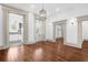 Elegant living room with hardwood floors, white trim, and doorways leading to other rooms at 35 Society St # D, Charleston, SC 29401