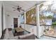 Outdoor porch area with a comfortable sofa and table, perfect for relaxing with a view at 35 Society St # D, Charleston, SC 29401