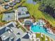 Aerial view showcases the pool, tennis courts, and surrounding lush landscaping of the community at 403 Hidden Meadow Ln, Summerville, SC 29486