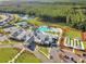 Beautiful aerial view of community featuring a clubhouse, pool, bocce ball court, and tennis courts at 403 Hidden Meadow Ln, Summerville, SC 29486