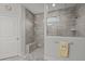 Updated bathroom features a large glass shower, tile surround, and a convenient built-in bench at 403 Hidden Meadow Ln, Summerville, SC 29486