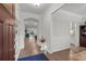 Welcoming foyer leading to open-concept living spaces with hardwood floors and modern finishes at 403 Hidden Meadow Ln, Summerville, SC 29486