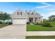 Charming single-Gathering home featuring a well-manicured lawn and a two-car garage with traditional architectural details at 403 Hidden Meadow Ln, Summerville, SC 29486