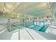 Bright indoor pool featuring natural light, ample space and clear lane markers for swimming at 403 Hidden Meadow Ln, Summerville, SC 29486