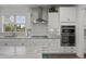 Bright and airy kitchen featuring stainless steel appliances, white cabinets and granite countertops at 403 Hidden Meadow Ln, Summerville, SC 29486