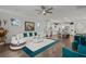 Bright living room with comfortable sofa, stylish rug, and views of the gourmet kitchen at 403 Hidden Meadow Ln, Summerville, SC 29486