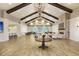 Elegant clubhouse lounge featuring a fireplace, multiple seating areas, and high vaulted ceilings at 403 Hidden Meadow Ln, Summerville, SC 29486