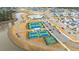 Aerial view of tennis courts, a basketball court, and a lake near neighborhood homes at 403 Ripple Park Dr, Summerville, SC 29486