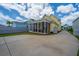 Charming yellow home featuring a spacious backyard with a screened porch at 403 Ripple Park Dr, Summerville, SC 29486
