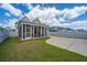 Charming yellow home featuring a spacious backyard with a screened porch at 403 Ripple Park Dr, Summerville, SC 29486