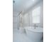 Bright bathroom with a freestanding tub and a glass-enclosed shower with white tiling at 403 Ripple Park Dr, Summerville, SC 29486