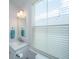 Bright bathroom featuring a modern vanity with countertop sink and a window at 403 Ripple Park Dr, Summerville, SC 29486