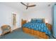 Cozy bedroom featuring blue accents, hardwood floors, ceiling fan, and an ensuite bathroom at 403 Ripple Park Dr, Summerville, SC 29486