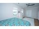 Bright bedroom with a ceiling fan, two windows and warm-toned hardwood floors at 403 Ripple Park Dr, Summerville, SC 29486