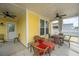 Cozy covered patio with wicker furniture and ceiling fans at 403 Ripple Park Dr, Summerville, SC 29486