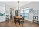 Bright dining area featuring a wooden table, hardwood floors, and natural light from the windows at 403 Ripple Park Dr, Summerville, SC 29486