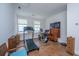 Spacious exercise room featuring a treadmill, stationary bike, and hardwood flooring at 403 Ripple Park Dr, Summerville, SC 29486
