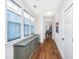 Hallway featuring hardwood floors, a sideboard, and natural light from the three windows at 403 Ripple Park Dr, Summerville, SC 29486