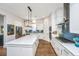 Bright kitchen with a spacious island, white cabinets, stainless steel appliances, and stylish backsplash at 403 Ripple Park Dr, Summerville, SC 29486