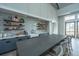 Stylish kitchenette features open shelving, attractive backsplash, seating for eight, and a convenient coffee bar at 403 Ripple Park Dr, Summerville, SC 29486