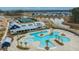 Aerial view of community pool and clubhouse surrounded by palm trees at 403 Ripple Park Dr, Summerville, SC 29486