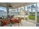 Inviting screened porch furnished with comfortable seating and a ceiling fan at 403 Ripple Park Dr, Summerville, SC 29486