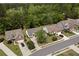 An aerial view of homes in a suburban neighborhood with mature trees and well-maintained lawns at 4872 Law Blvd, Summerville, SC 29485