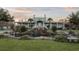 Gorgeous home showcasing a front yard with a water feature, lush landscaping, and a charming facade at 4872 Law Blvd, Summerville, SC 29485