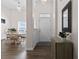 Bright foyer featuring hardwood floors, fresh white paint, a dining area and decorative mirror at 4872 Law Blvd, Summerville, SC 29485