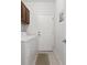 Efficient laundry room featuring tile floors, overhead cabinets, and a white washer and dryer set at 4872 Law Blvd, Summerville, SC 29485