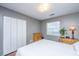 Cozy bedroom with hardwood floors, neutral paint, ample natural light, and closet with bi-fold doors at 505 Laurel Ridge Rd, North Charleston, SC 29418