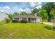 Traditional home with gray siding, manicured lawn, trimmed shrubs, and inviting front porch at 505 Laurel Ridge Rd, North Charleston, SC 29418