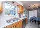 Kitchen with wooden cabinets and a view of the dining area at 505 Laurel Ridge Rd, North Charleston, SC 29418