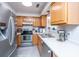 The kitchen features wooden cabinets and stainless steel appliances at 505 Laurel Ridge Rd, North Charleston, SC 29418