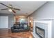 Open-concept living space featuring hardwood floors, a fireplace, and a view into the kitchen at 505 Laurel Ridge Rd, North Charleston, SC 29418