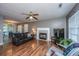 Inviting living room with hardwood floors, a fireplace, and seamless flow into the dining area at 505 Laurel Ridge Rd, North Charleston, SC 29418