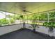 Comfortable screened-in porch with ample space for relaxation and enjoying views of the serene backyard at 505 Laurel Ridge Rd, North Charleston, SC 29418