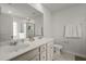 Bathroom featuring double sinks, a glass shower, vanity, and neutral wall color at 5222 American Holly Ln, Ladson, SC 29456