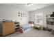 Bright bedroom with toys, a bed, light-colored walls, and a window bringing in natural light at 5222 American Holly Ln, Ladson, SC 29456