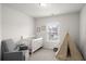 Charming Bedroom with crib, chair, teepee tent, and a bright window for natural light at 5222 American Holly Ln, Ladson, SC 29456