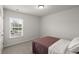 Bedroom featuring carpet floors, a single bed, a window, and neutral paint color at 5222 American Holly Ln, Ladson, SC 29456