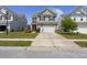 Charming two-story home with a two car garage, manicured lawn and flower beds at 5222 American Holly Ln, Ladson, SC 29456