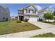 Charming two-story home with a two car garage, manicured lawn and flower beds at 5222 American Holly Ln, Ladson, SC 29456