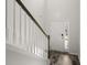 The foyer shows a staircase with white banisters and hardwood floors at 5222 American Holly Ln, Ladson, SC 29456