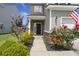 Beautiful landscaping leads up to the front door of this two-story home at 5222 American Holly Ln, Ladson, SC 29456