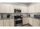 Well-lit kitchen features granite counters, stainless steel appliances, and ample cabinet storage space at 5222 American Holly Ln, Ladson, SC 29456