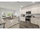 Open kitchen with granite countertops, stainless steel appliances, and plenty of natural light at 5222 American Holly Ln, Ladson, SC 29456