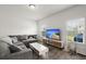 Spacious living room with a comfortable couch, modern furniture, and lots of natural light at 5222 American Holly Ln, Ladson, SC 29456